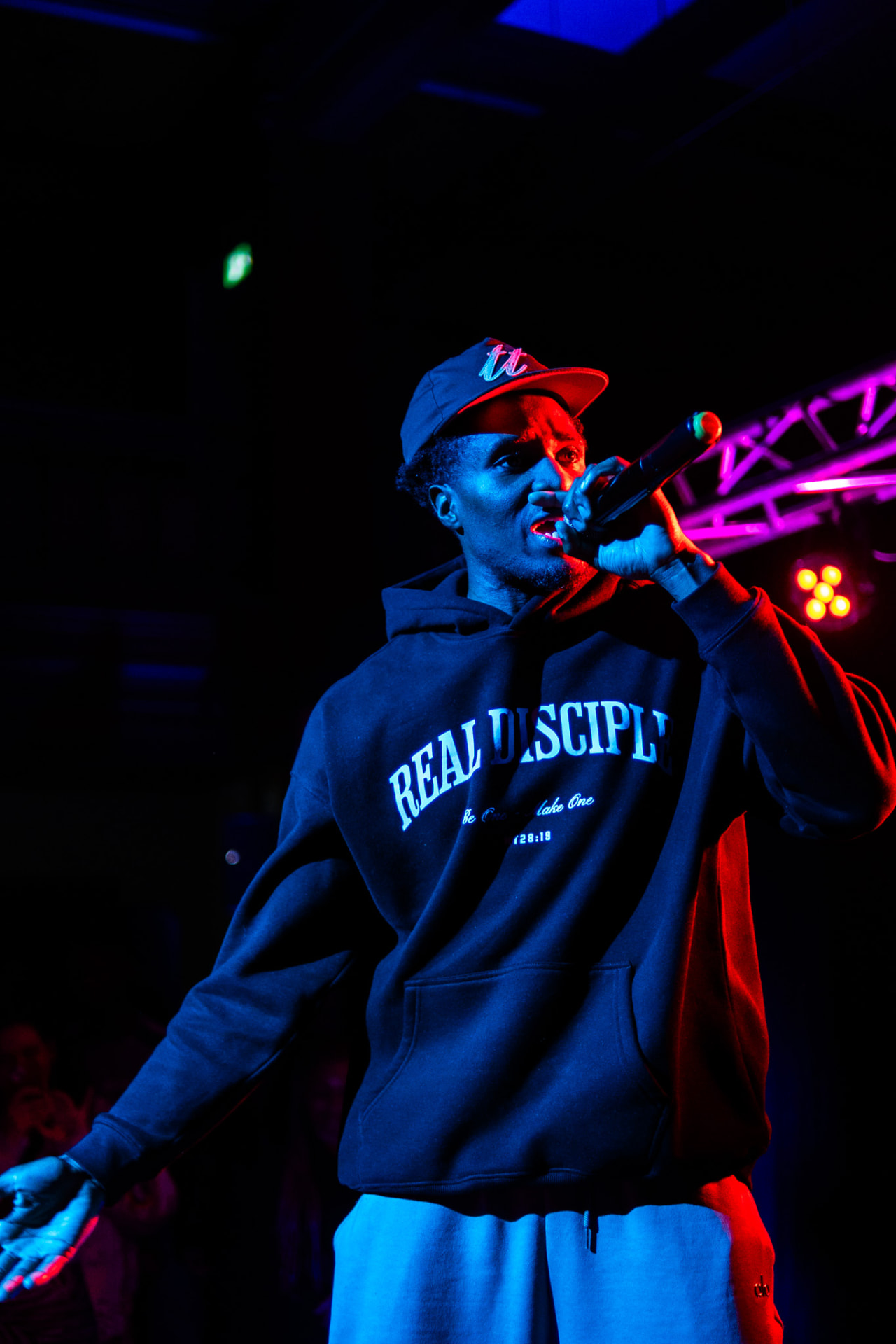 Real Disciple live performance with red and blue stage lighting